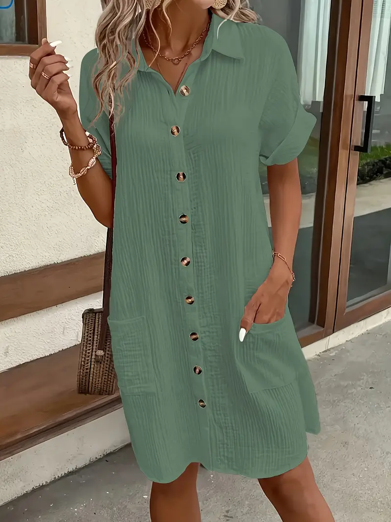 a minimalist white shirt dress made of breathable featuring a sharp collar design and buttons that add a touch of details 13