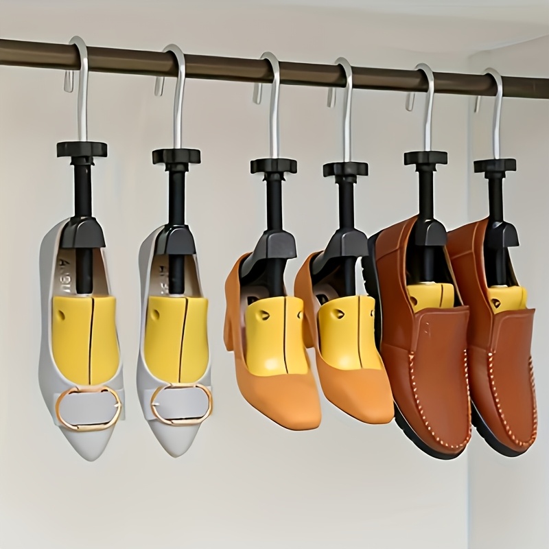 Un juego de estiradores de zapatos diseñados para ajustes de longitud y ancho - Estos expandidores de zapatos ajustables presentan ajustes en cuatro direcciones y están hechos de plástico duradero, ideales para reparaciones de zapatos, reajuste y el cuidado general de los zapatos