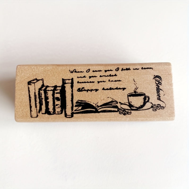 Image of A Wooden Rubber Stamp Featuring Coffee And Book Designs, Perfect For Projects, Journaling, And Greeting Cards