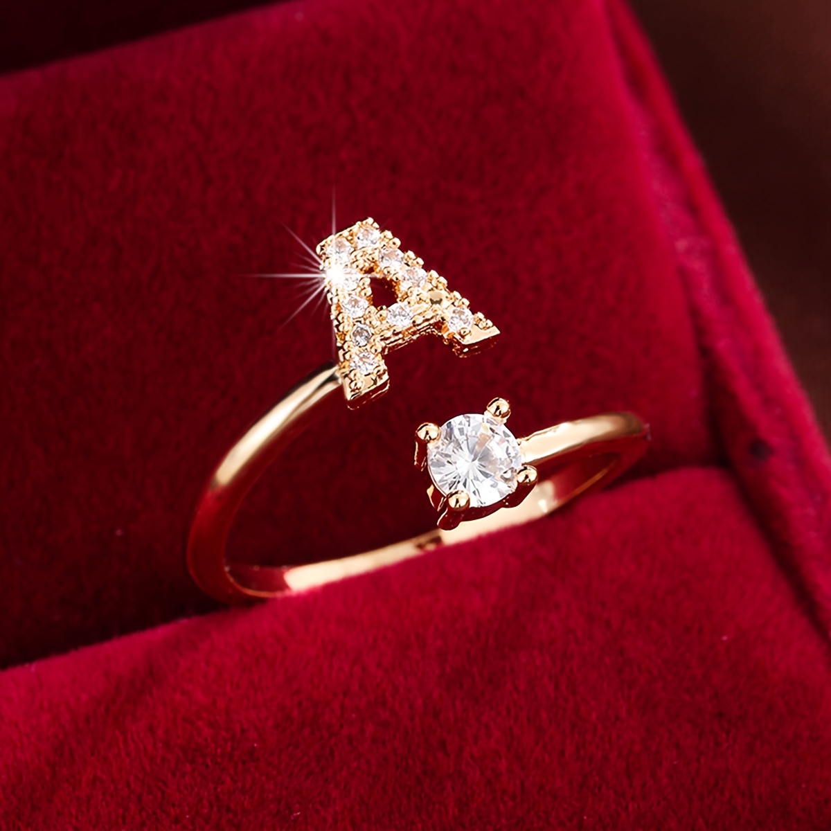 a stylish letter design ring for women featuring a zirconia inlay and an adjustable open band