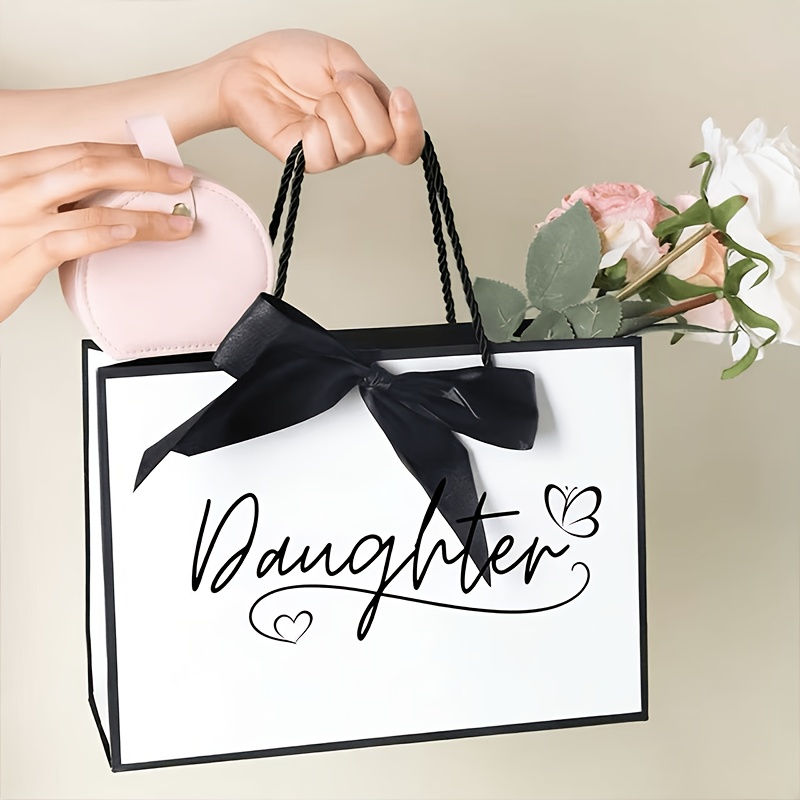 1 Daughter Gift Bag, A Paper Gift Bag Designed For A Birthday - Featuring "daughter" Printed With Heart And Accents, A Lightweight And Foldable Shopping Tote With A Black Ribbon, Gift