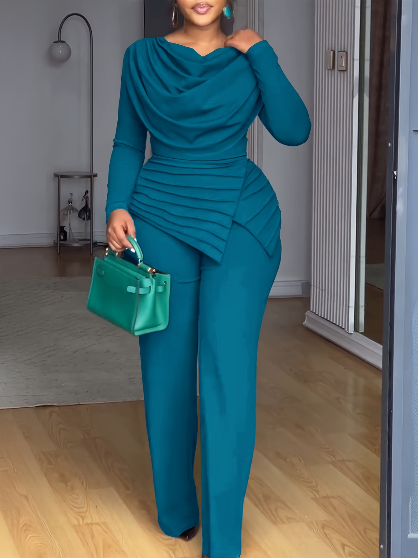 A Long-Sleeved Top with a Gathered Design And a Waist-Cinching Feature, Paired with Wide-Leg Jumpsuits