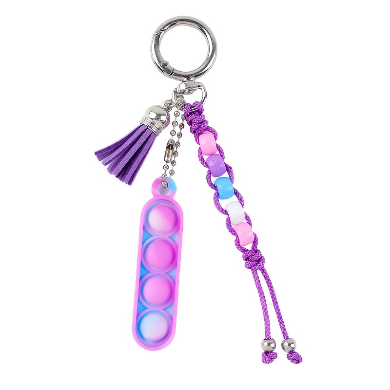 TEMU A Macaron Gradient-colored Long Press-bubble Woven Tassel Keychain, Hand-woven With A Matching Color Tassel And Round Beads. The Silicone Bubble