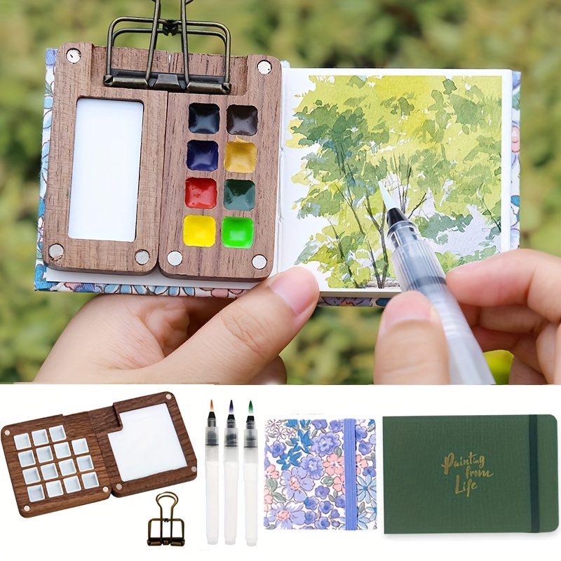 

Ensemble de 6 Mini Peintures Aquarelles en Bois avec Palette, Pinceau Stylus, Pinces & Carnet de en Tissu - Kit d'Art Portable pour l'Extérieur pour 8/15 Couleurs (Peinture Non Incluse)