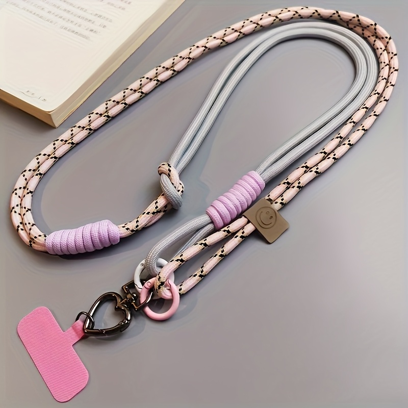 E-shop Vielseitige Crossbody-Handyhalterung - Schicker geflochtener Stil mit pinken und weißen Akzenten, robustes Nylonmaterial, geeignet für