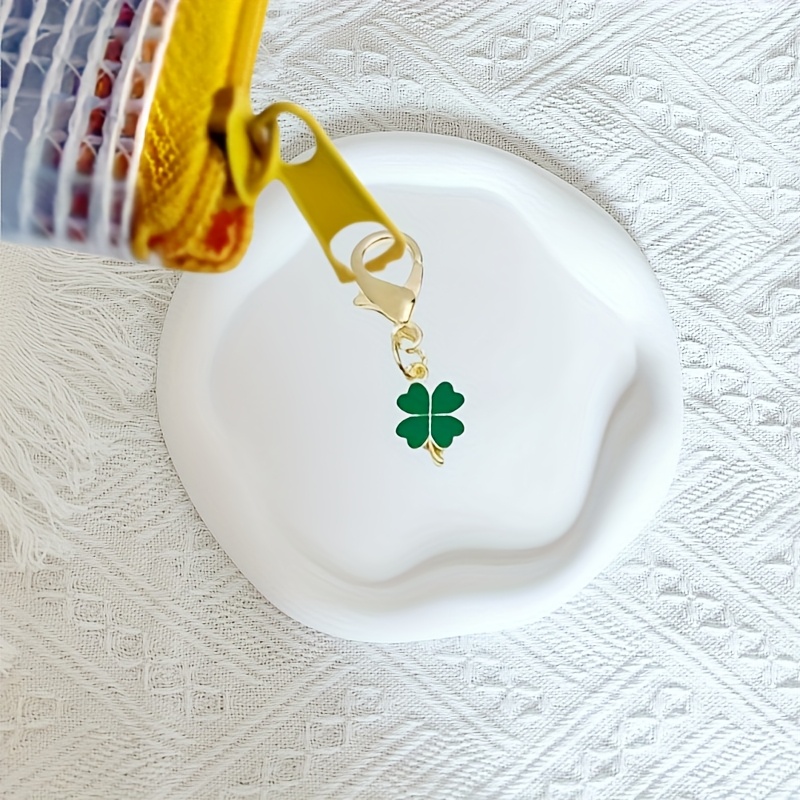 A Sparkling Dreamcatcher Car Pendant - an Exquisite Rearview Mirror Decoration with a Shiny Feather Design - a Car Interior Accessory, Accompanied by Two Four-Leaf Clover Bag Charms - an Ideal Birthday Gift for Elegant Women.