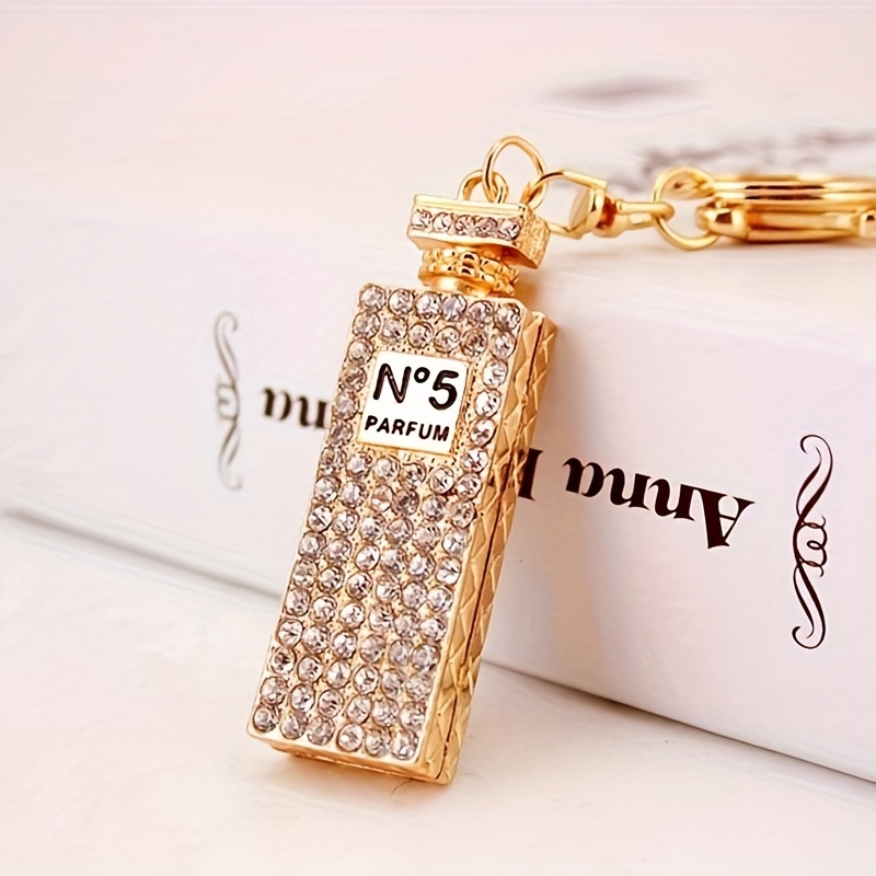 

1pc Rhinestone Perfume Bottle Keychain, Long Parfum Pendant Zinc Alloy, Crystal-embellished, Fashionable Accessory For Women
