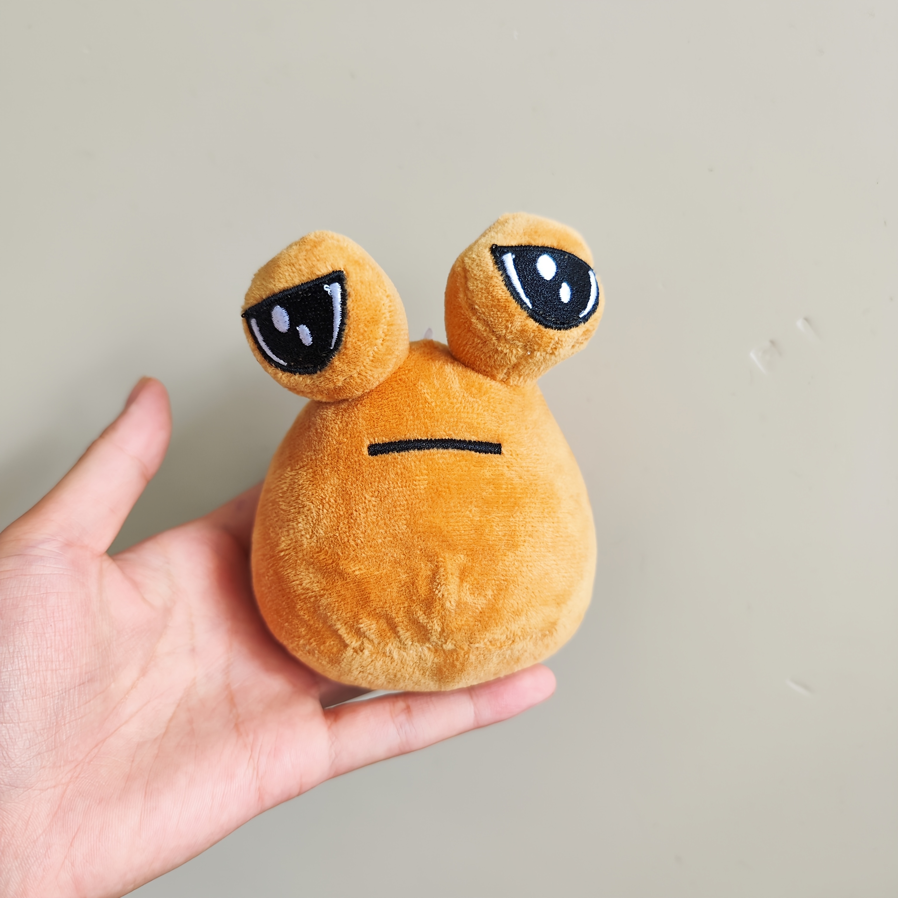 black pou plush sold on Temu Canada