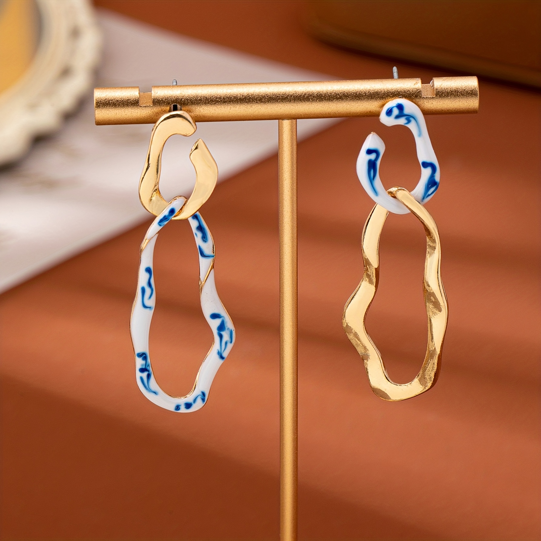 Image of A Pair Of Elegantly Designed Asymmetrical Drop Earrings Featuring Blue And White Hand-painted Porcelain Pattern, Outfits, Parties, And As Gifts (blue Patterns May )