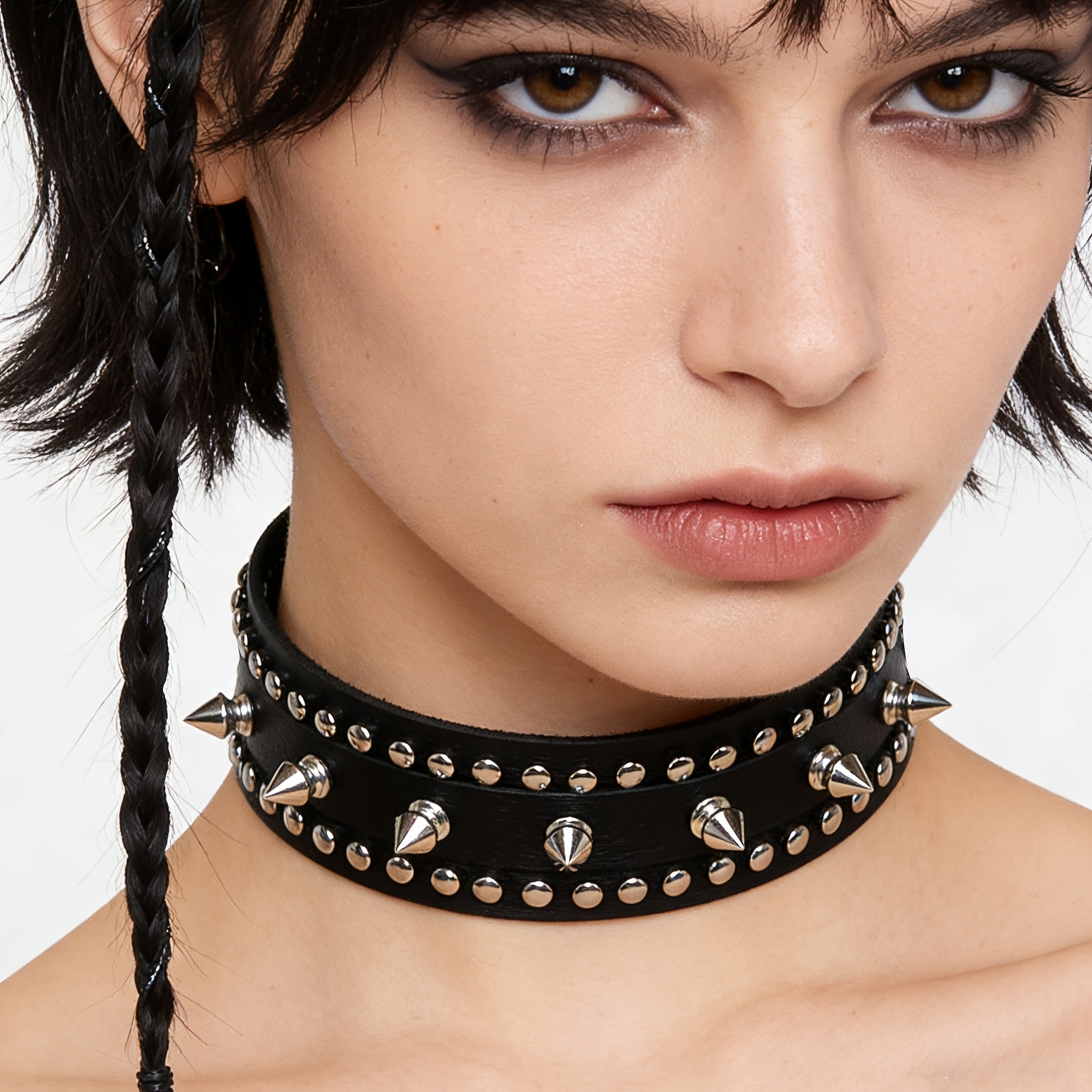 a gothic style punk choker made of faux leather with spikes     parties and suitable for everyday wear featuring an adjustable studded design