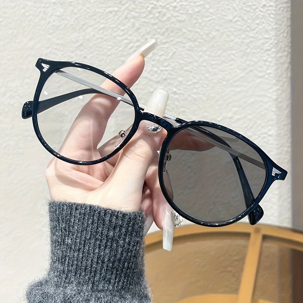 1 pair of unisex oval frame fashion glasses with photochromic lenses that change color in sunlight suitable as a holiday gift for  