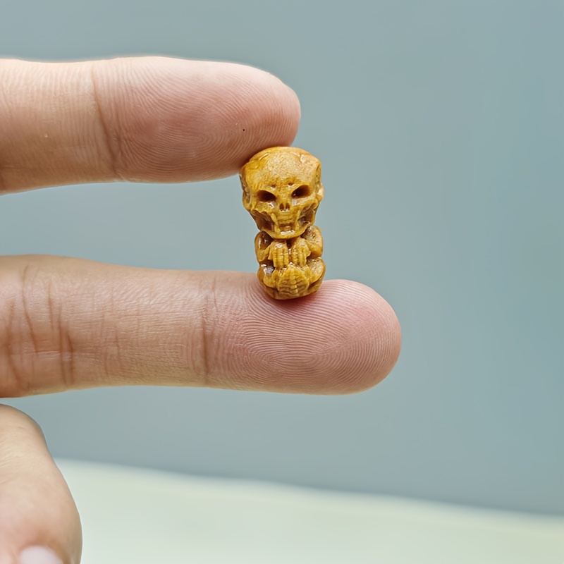 Image of A Carved Sandalwood Ornament With Beads, Featuring Through Holes Suitable For Bracelets, Creative Halloween Bracelet Additions, And Can Be Used For Necklace Pendants Or Backpack Charms
