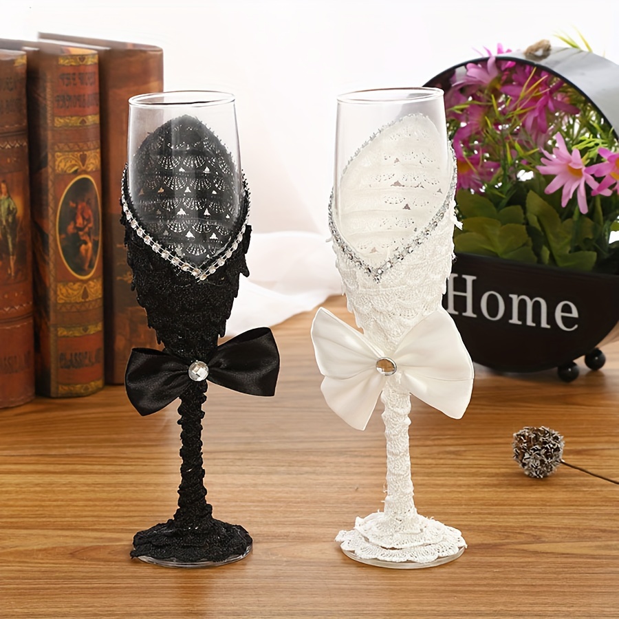 A Set Of Western-style Wedding Flutes And Black And White Wine Glasses, Perfect For Wedding Celebrations