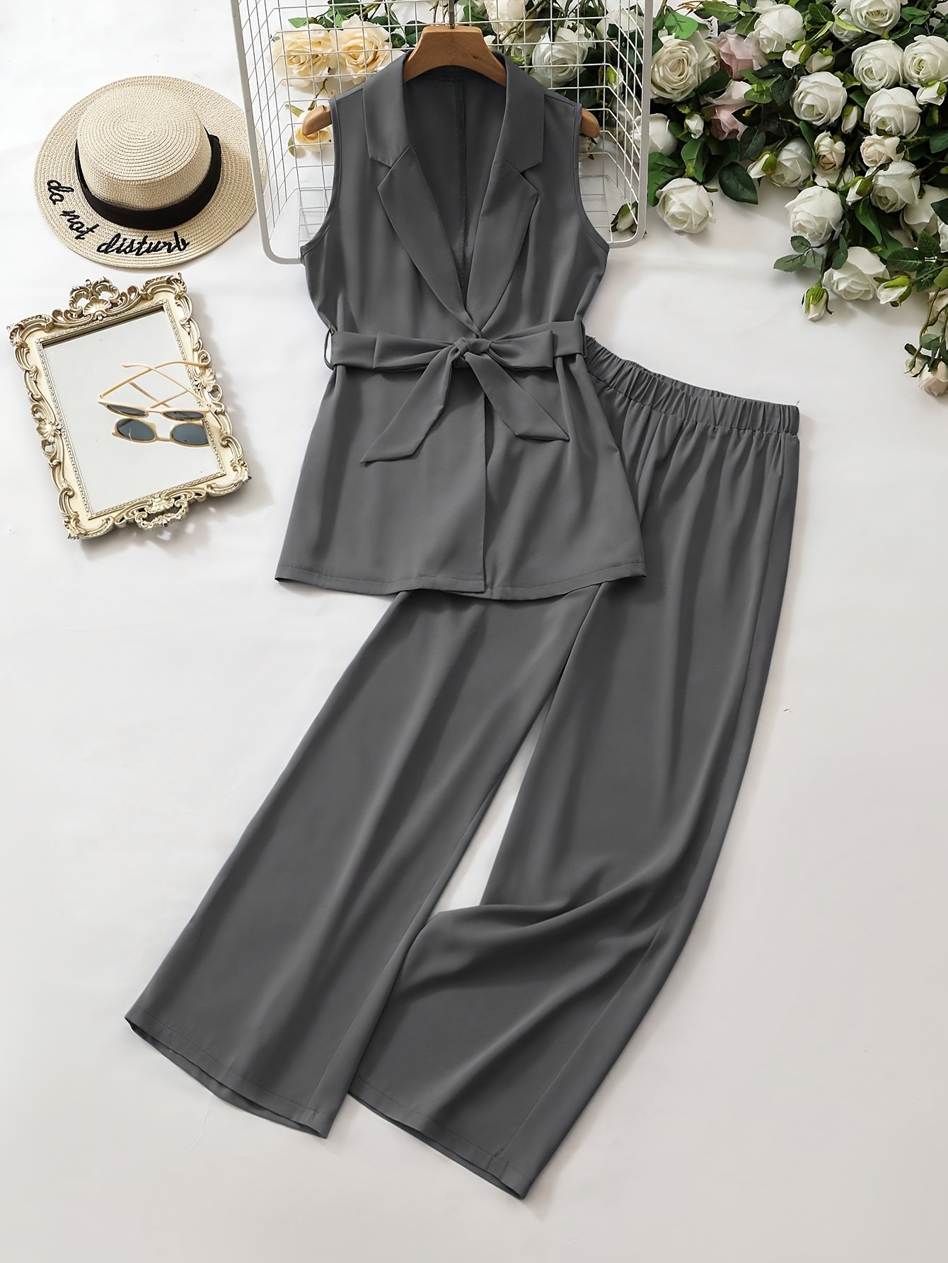 Model showcasing Newness Effortless Chic Vest Pant Set a stylish two piece outfit perfect for summer The set features a chic vest and coordinating pants in a sophisticated design