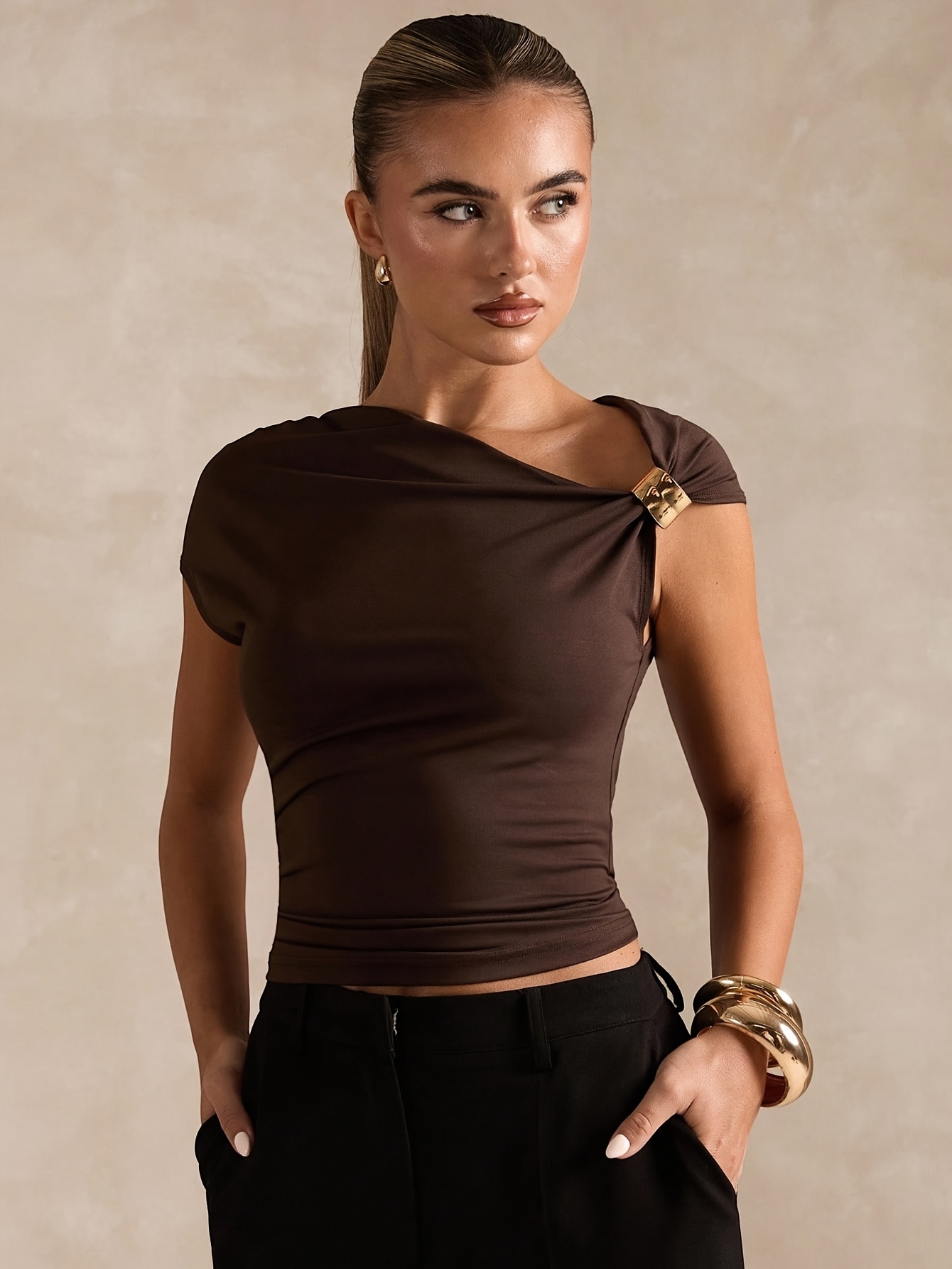   and summer fashion features a easy and elegant solid color top with asymmetric off shoulder design and metallic accents for women this stylish t shirt is tailored with a solid color and asymmetric neckline