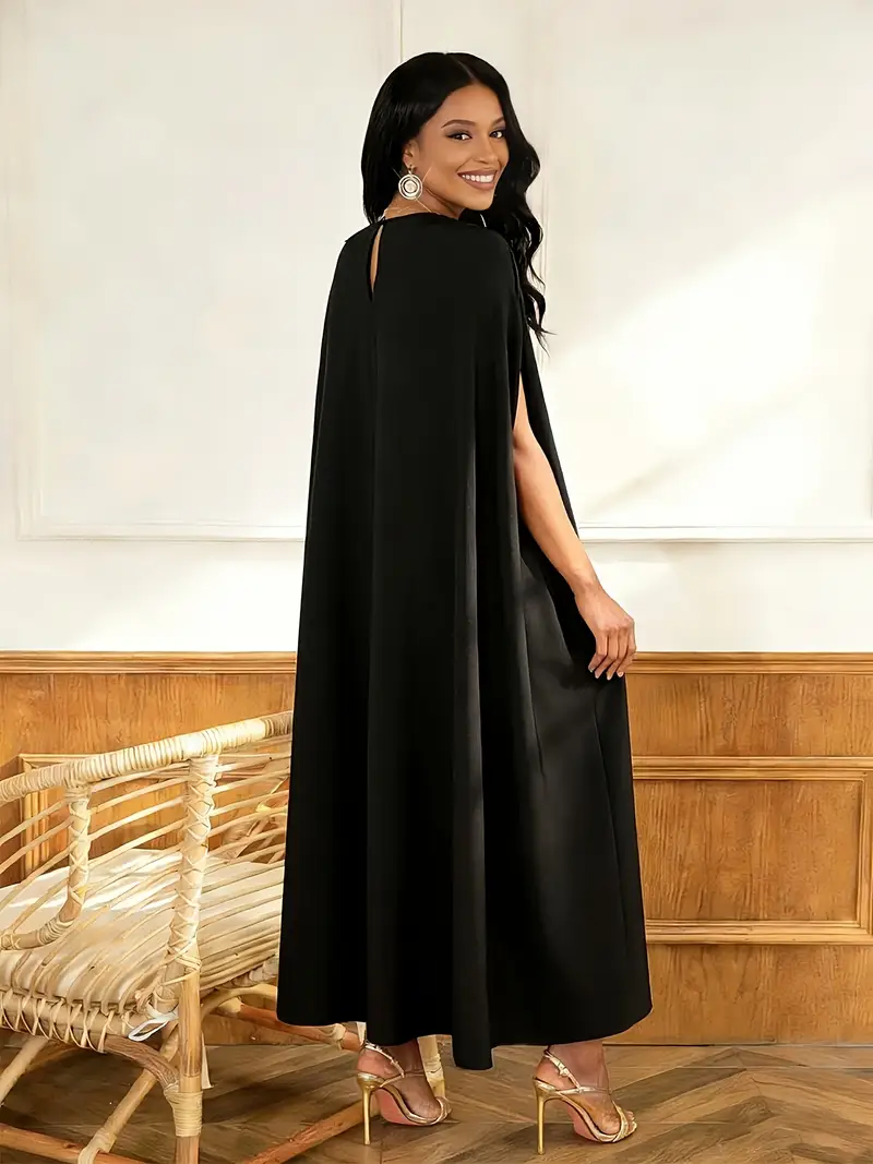 black dress with red cape Black dress embroidered with red and with a side cape