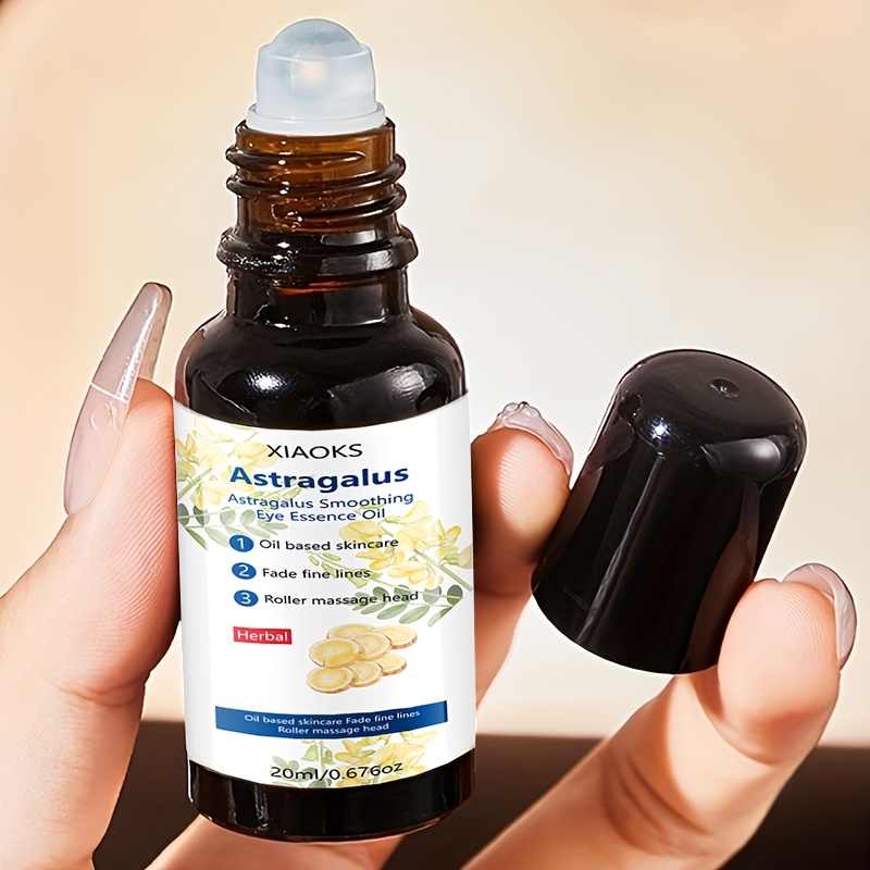 [Strângere Instantanee] Loțiune Esență Netedă pentru Ochii cu Astragalus. Esența pentru Ochii Netezește Rapid Ochii Umflați, Hidratează, Iluminează și Reduce Cercurile Întunecate, Pungile de Sub Ochi și Ridurile. Este Ideală pentru Ochii Umflați și Ajută la Reducerea Semnelor de Oboseală, Mate și