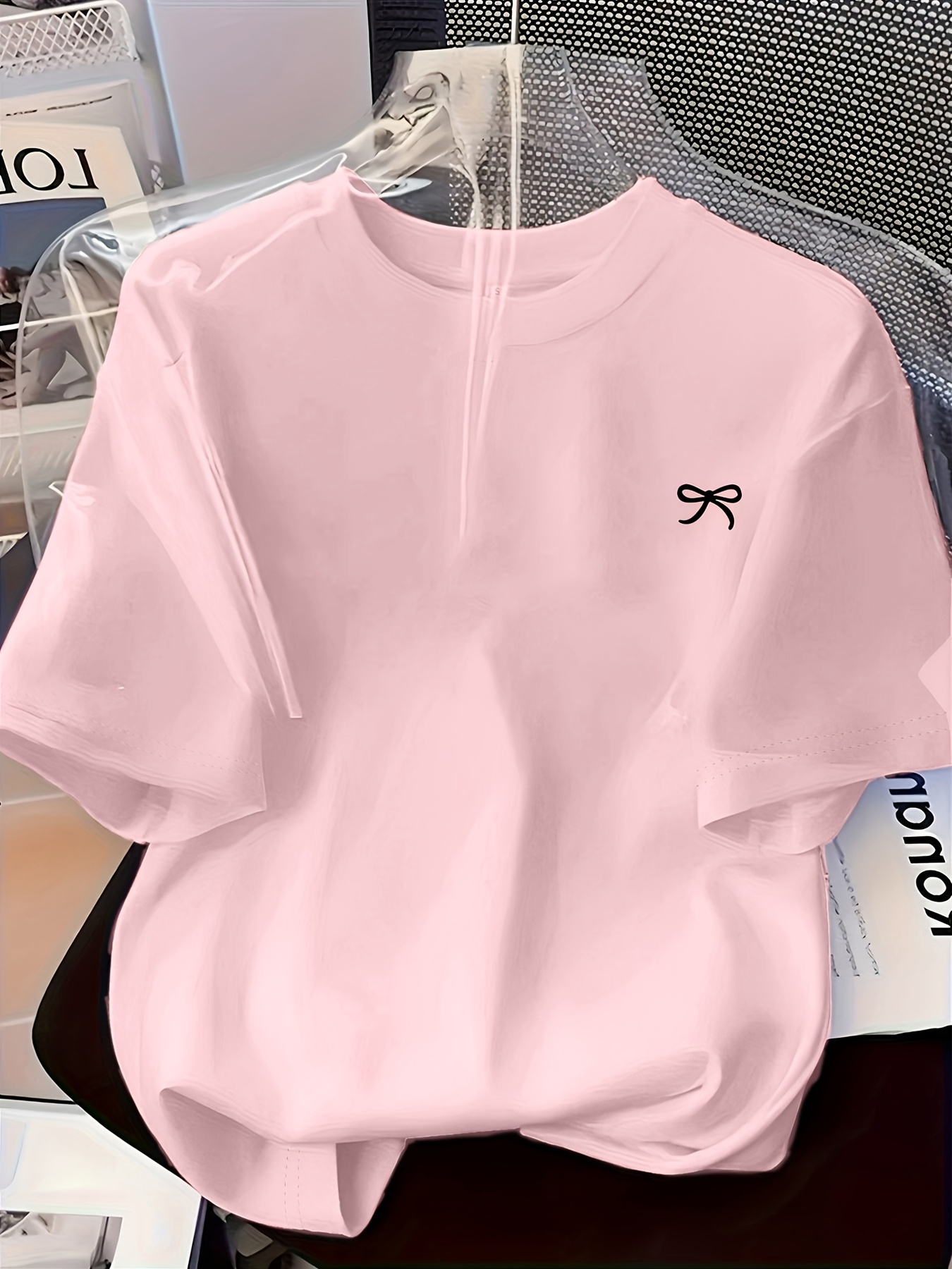   womens round neck design featuring a easy artistic bow pattern print   casual and comfortable casual attire with a versatile short sleeve t shirt