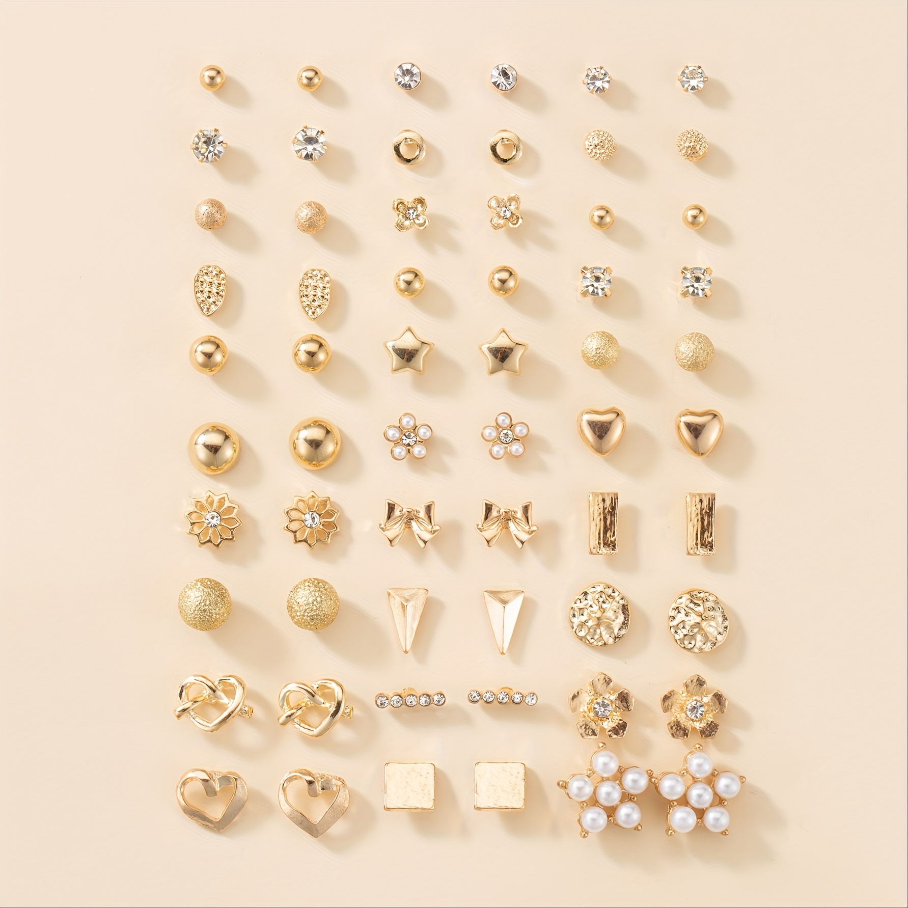 

A Set Of 30 Pairs Of Minimalist Golden Earrings, Perfect As A Stylish Gift For Holidays And Birthdays, Suitable For Wear.