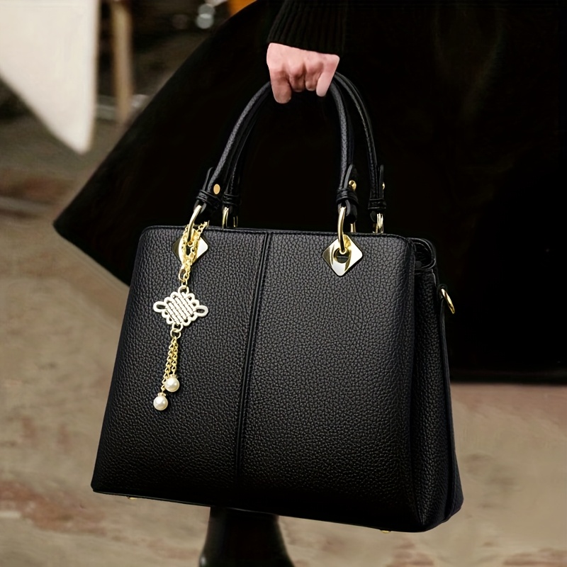 Stylish Black Handbag with Adjustable Strap