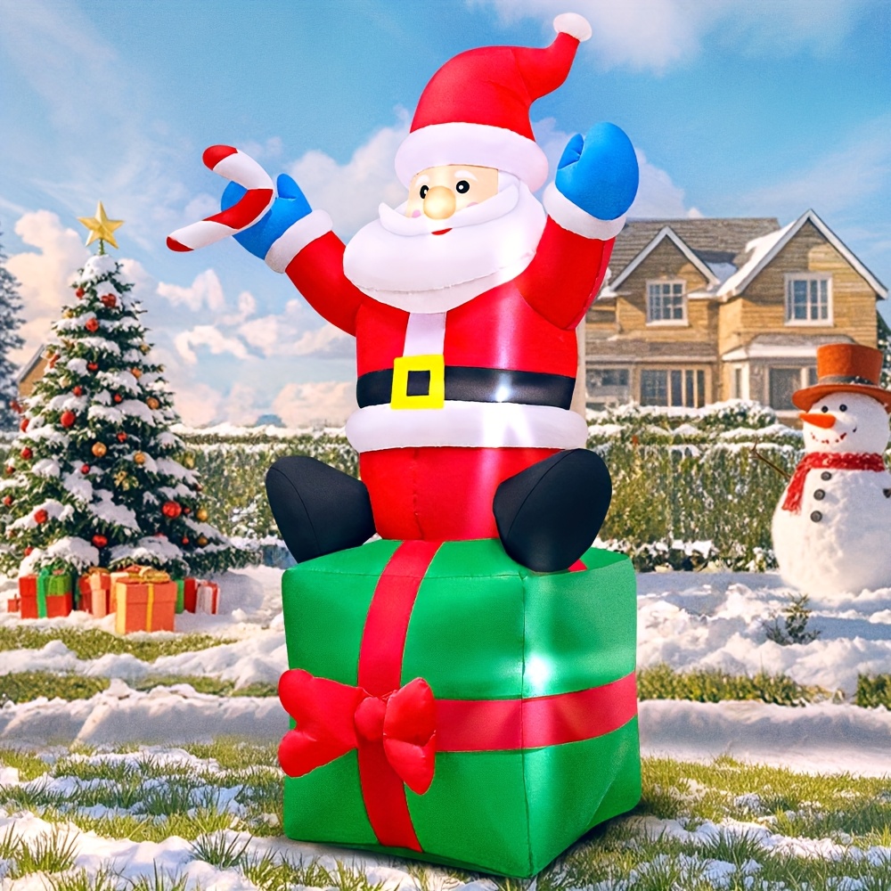 Santa sitting outlet on present Christmas inflatable