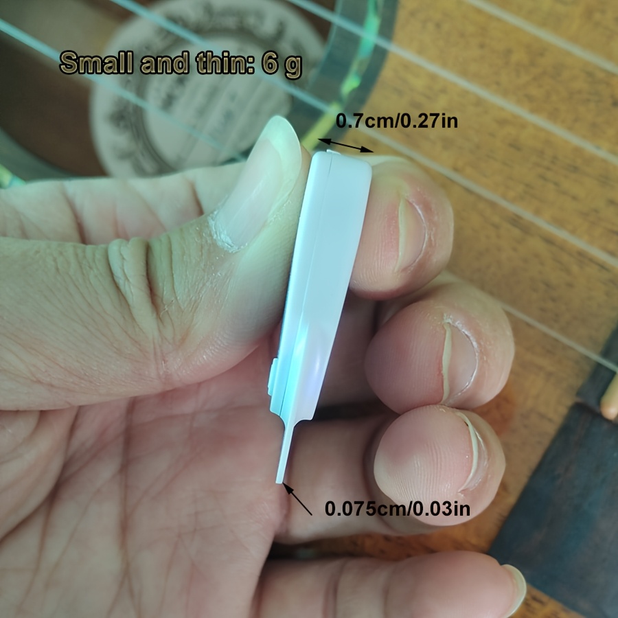 Dual-Purpose Instrument Tuner with Pick Function, Compact and Lightweight Design, Sensitive Sound Detection, 12-Tone Equal Temperament Mode Suitable for All Musical Instruments, Studio Equipment, Musical Instrument Tuning, Portable Tuner, Sleek Tuner, Durable Construction, Accurate Pitch Tool, Dualpurpose Tuner, Sound Detection Tuner, Piano Tuners, Musicians