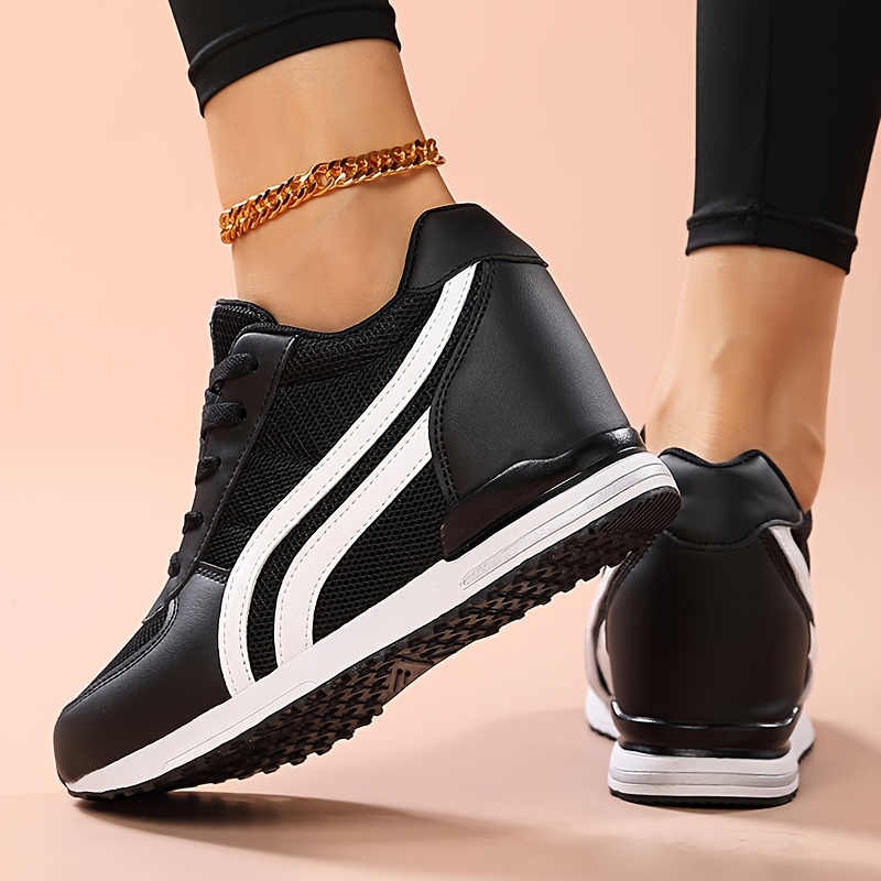 Black ladies wedge sneakers sold by 100 Spartans