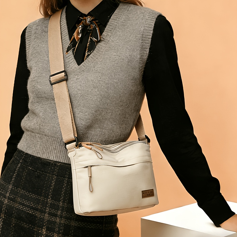 TEMU 's Crossbody Bag Has A Large Capacity, Multiple Layers With Zippers For Closure, An Adjustable Shoulder Strap, Suitable For Casual And Daily Use