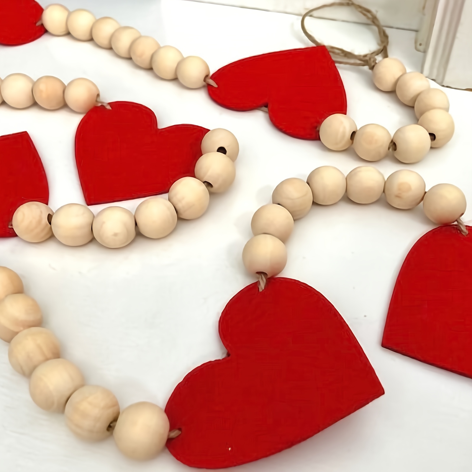 

A Love Banner For Valentine's Day Featuring A Heart-shaped Wreath With Wooden Beads For Party Decoration.