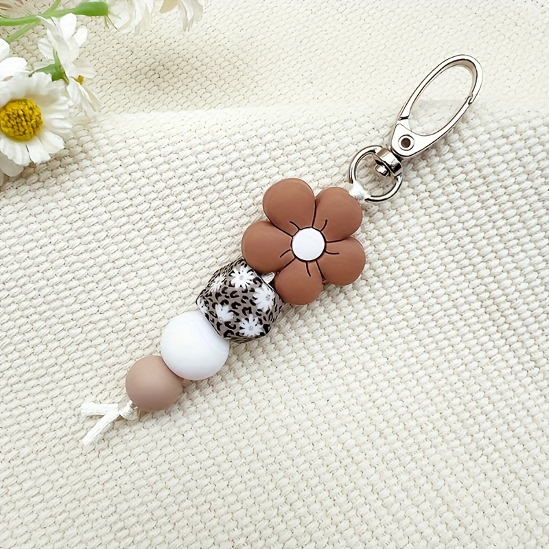 TEMU 1pieza Pulsera de llavero de cuentas de silicona con daisy y pulsera de leopardo, pendiente decorativo elegante beige y para bolsos, llaves,