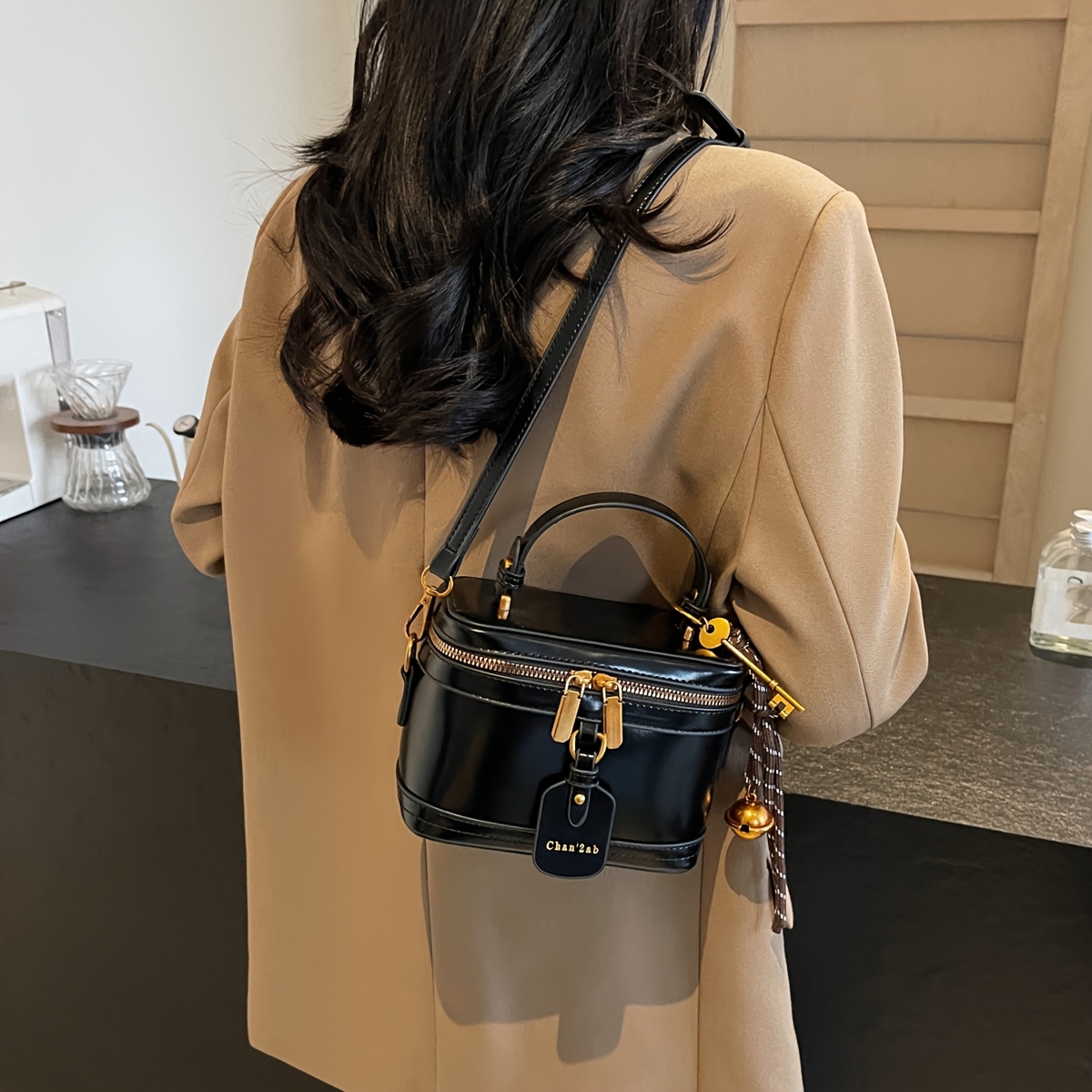 Elegant Retro Women's Crossbody Bag with Bell Pendant – Stylish Brown Handbag with Adjustable Strap, Zipper Closure, and Golden-Tone Hardware for Work, Date, Shop, and Party