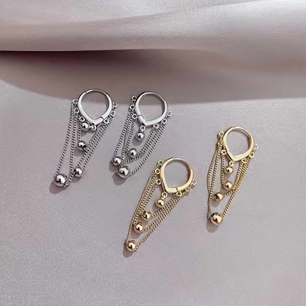 Stylish Tassel Earrings with Golden Sphere Pendant