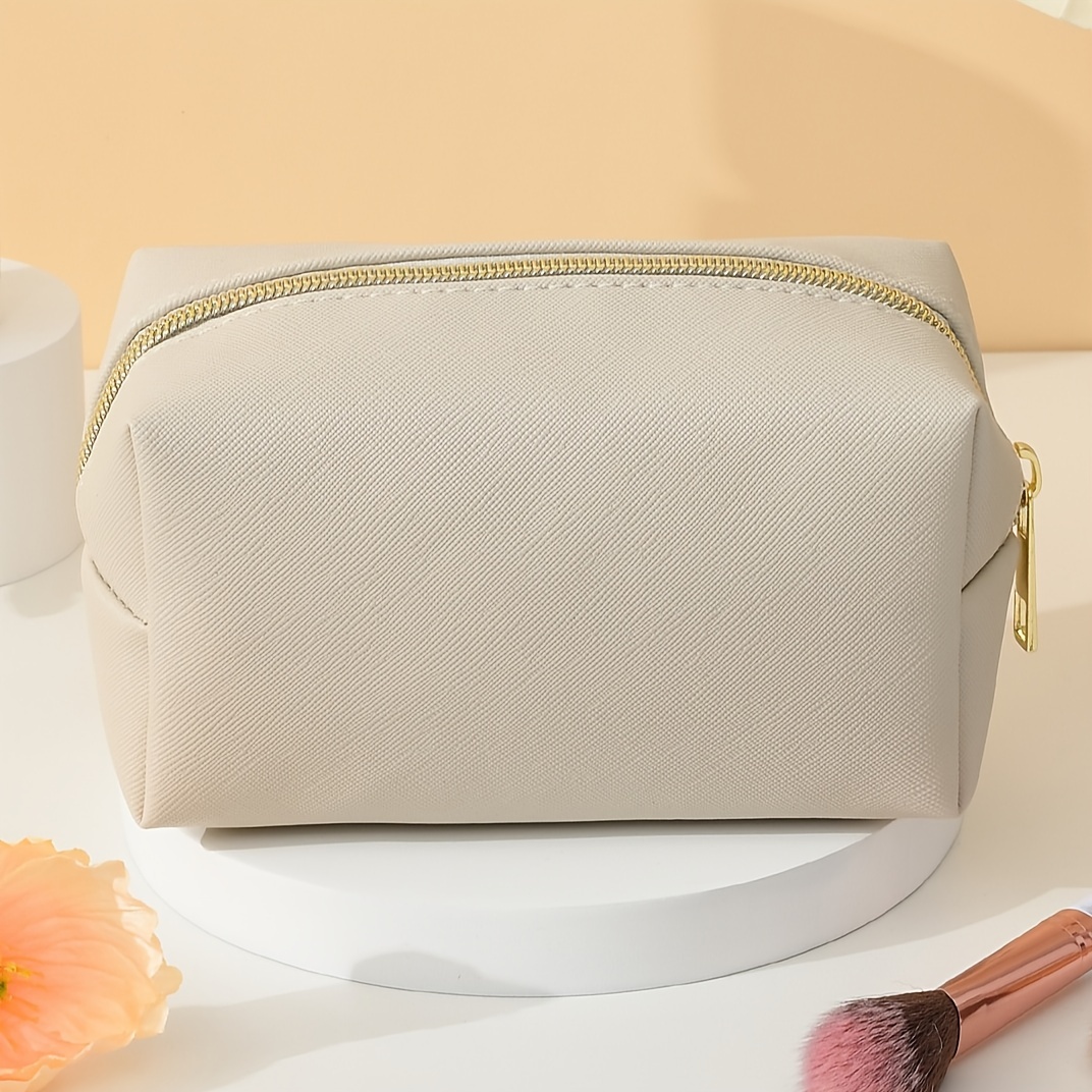 E-shop Ein stilvolles, minimalistisches ästhetisch ansprechendes tragbares PVC-Kreuzmuster-Reise-Makeup-Täschchen
