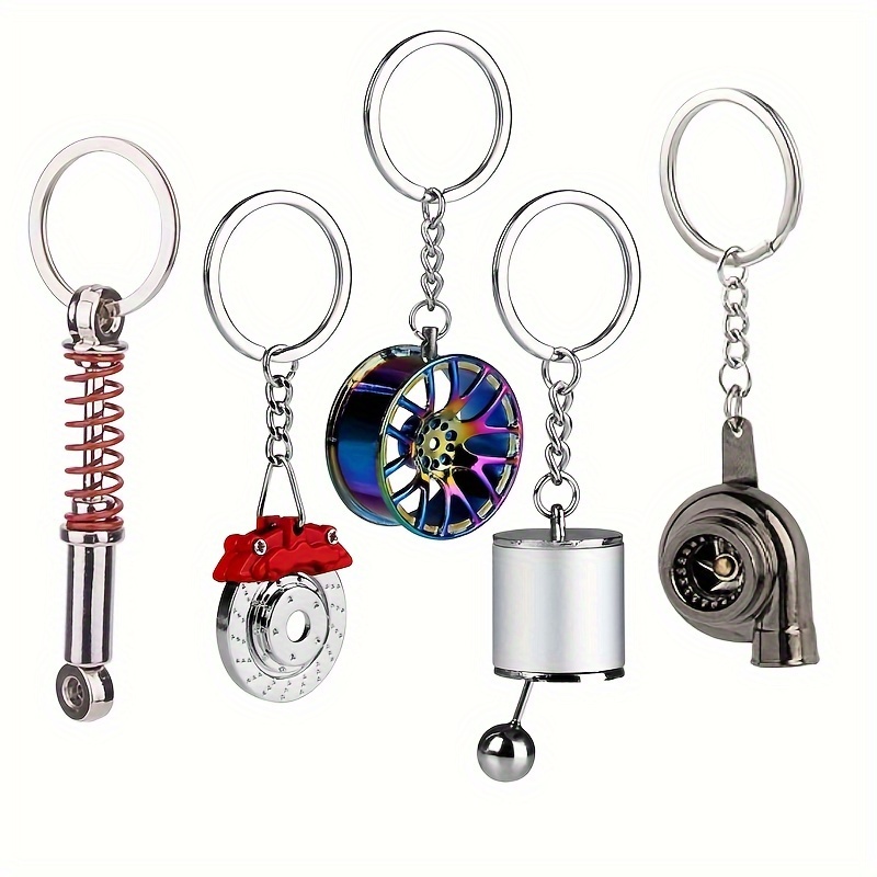 

5pcs Car Parts Keychain Set, Sporty Car Enthusiast Gift, Auto-themed Keyring Collection - Black Turbo, Silver Gearbox, Rainbow Tire Rim, Red Brake Rotor, Red Spring Shock Absorber