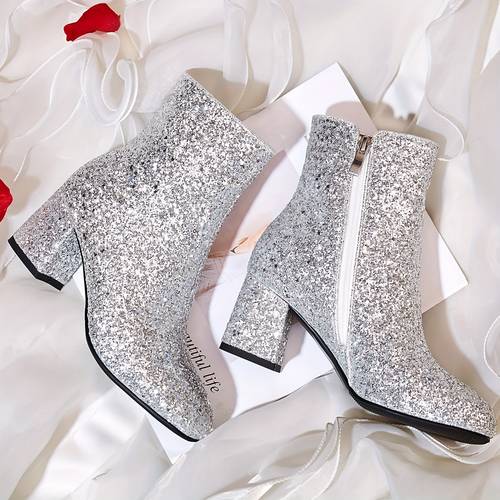 elegant high heeled shoes with sequins in golden and silvery colors are weddings parties carnivals and concerts