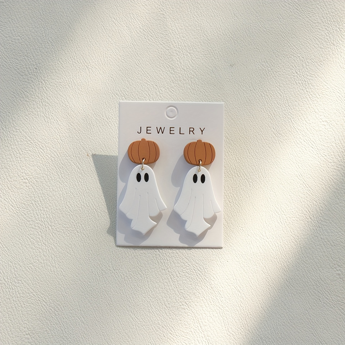 A Pair Of Stylish Minimalist Brown Pumpkin Earrings With White Acrylic Pendants, Perfect For Women's Party Gifts For Halloween
