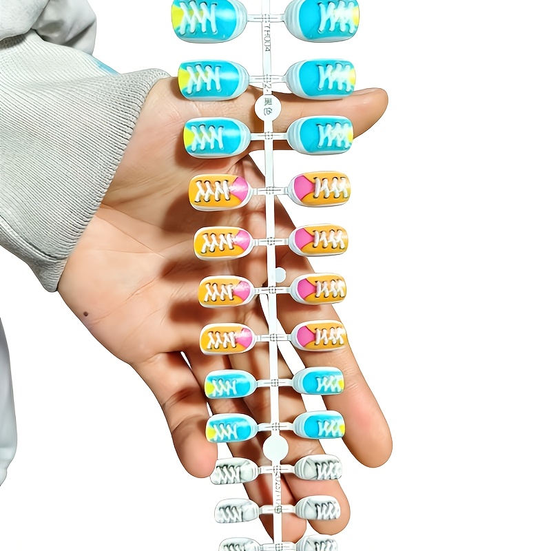 TEMU Colorful Press-on Nails Featuring Blue, Orange, White, And Pink With Sneaker-style Designs And Striped Lace-up Patterns. Short Oval-shaped Nails