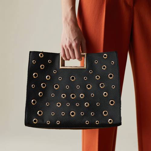 womens vintage black tote bag with circular studs magnetic closure fixed shoulder strap handbag for work parties versatile accessory metallic zipper closure party accessory retro style durable material detachable strap party
