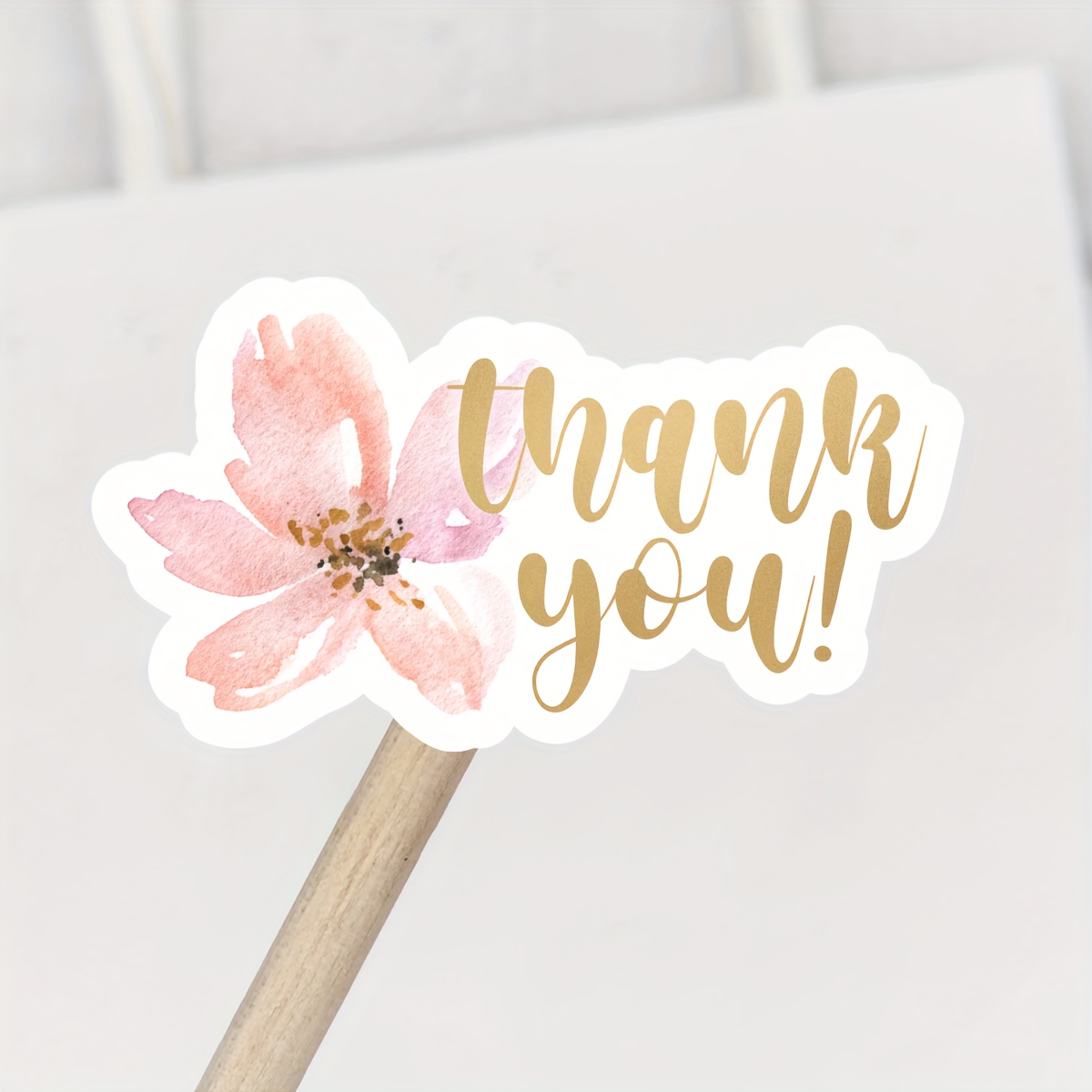 Image of A Roll Of 200 Thank You Stickers Featuring Blush Pink Flowers, Perfect For Packages, With Watercolor Designs, Measuring 1.5 Inches By 0.8 Inches