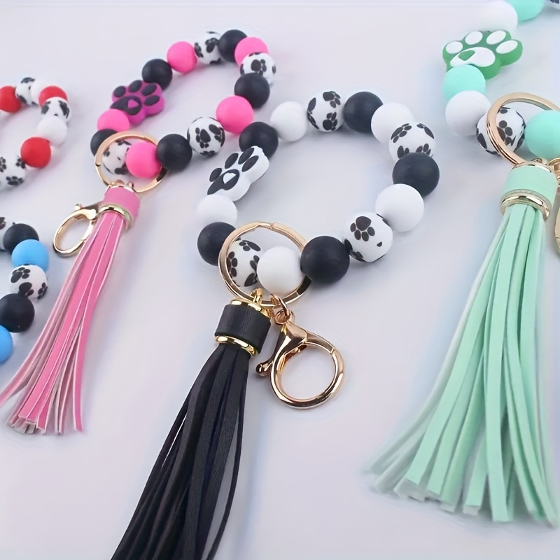 

Paw Print Beaded Keychains With Tassel, Dog Lover Charm Key Ring, Fashionable Simple Pet Paw Hand Bag Car Accessory, Assorted Colors