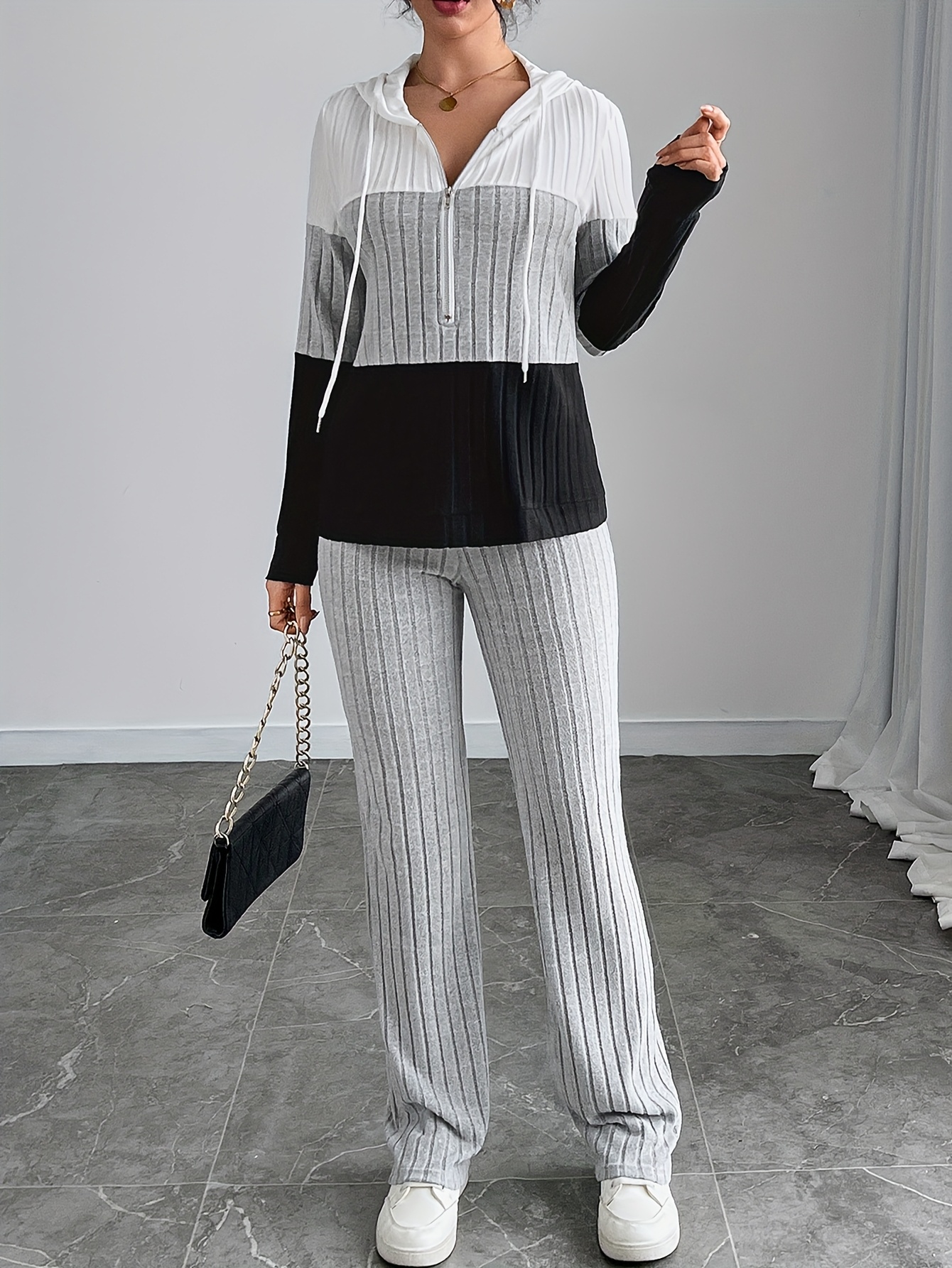 Model wearing the elegant patchwork hooded pants suit, image 1