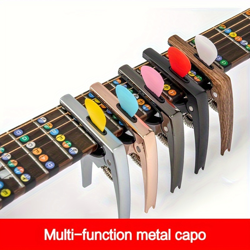 

A Zinc Alloy Capo With 3 Functions, Can Be Used As A Capo, A Pick, And A String Nailer Available In 5 Colors, Suitable For Guitar And Ukulele Comes With 3 Picks As A Gift