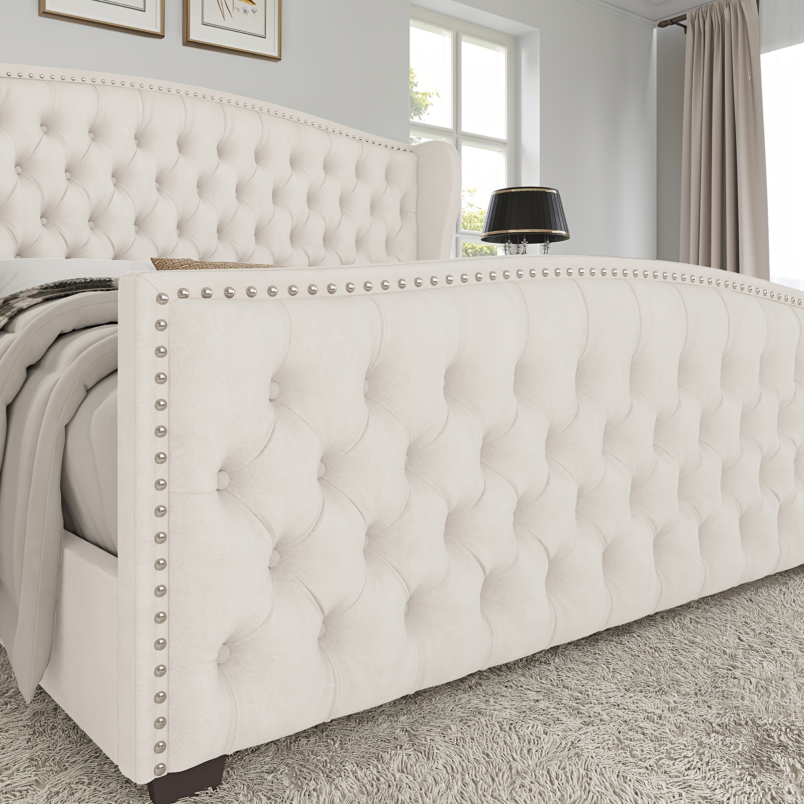 Handcrafted Velvet Bed Frame Featuring a Wingback Headboard, Adorned with Button Tufting And Nailhead Accents, Supported by Wooden Slats.