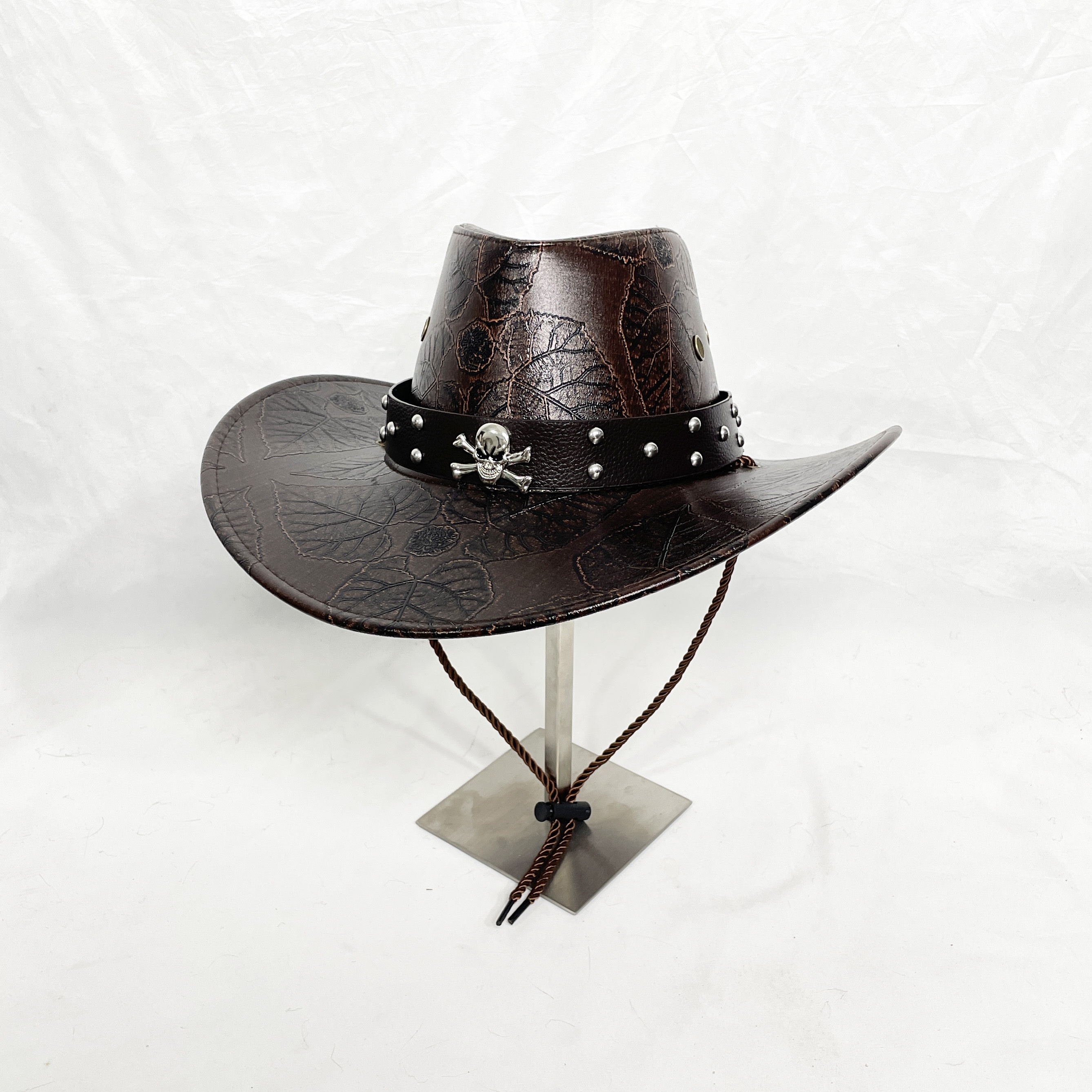 

Pu Leather Cowboy Hat With Classic Leaf Pattern, Skull Accent And Rivet Details - Lightweight, Inelastic, Yarn-dyed Western Hat With Stiff Brim Support And No Feathers - Care Instructions Included