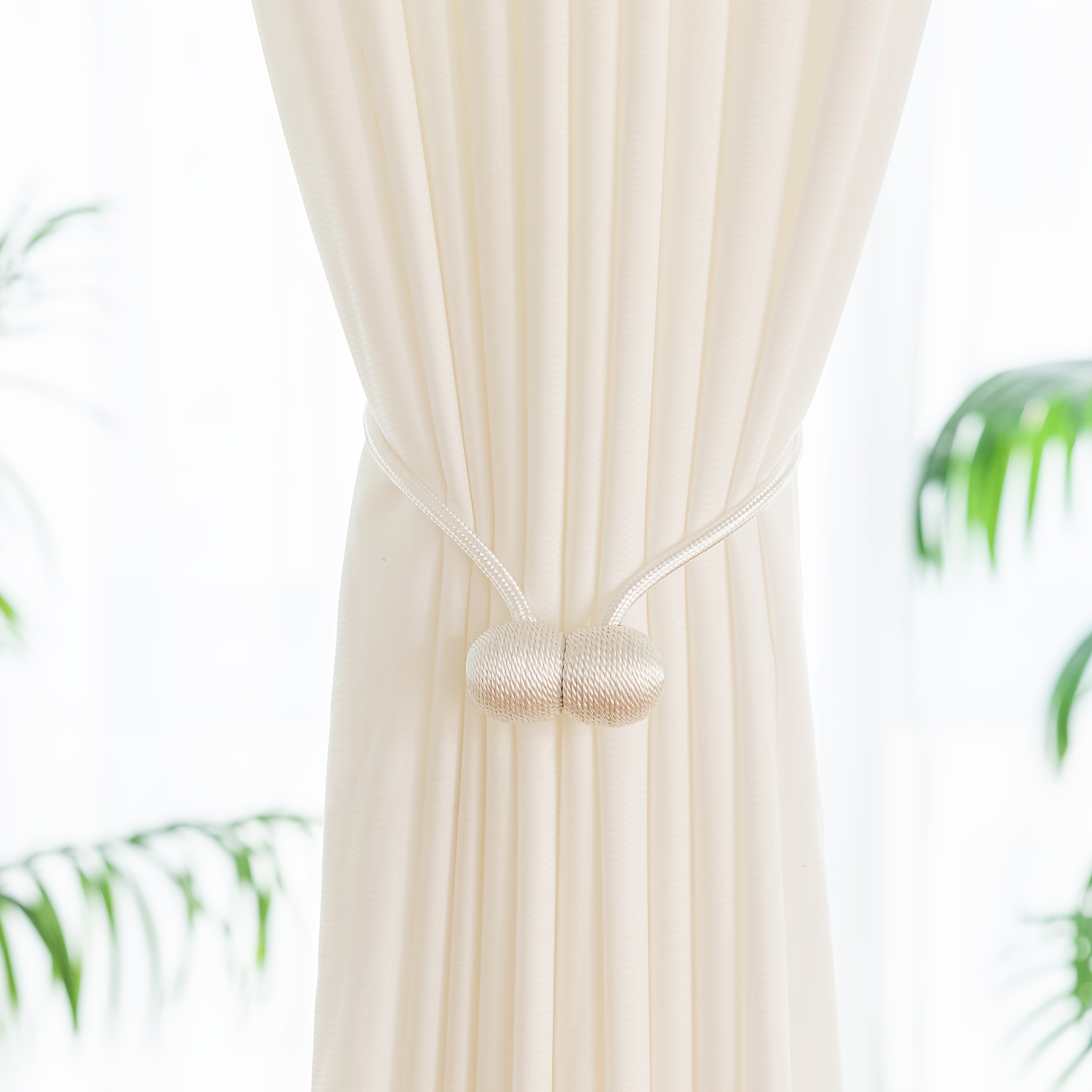 A Set of Two Modern Minimalist Magnetic Curtain Ties Is on, Featuring Thicker Twisted Ropes And Flexible Magnetic Ties. They Are Durable, Easy to Install, And Do Not Require Drilling, Making Them Perfect for Bedroom And Living Room Decor