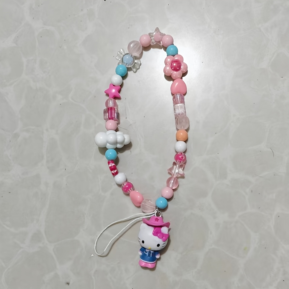E-shop Eine dekorative Kette für Handys mit Sanrio's Hello Kitty, komplett mit einem Original-Kartenautomaten CCD-Design. Dieser süße Anhänger kann als
