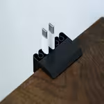 3D Printed Cable Organizer Clip for Desk Multi Slot Charging Cable Holder USB Cord Management Desk Edge Cable Holder for Home OfficeOpen in new tab.