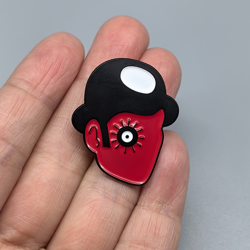 TEMU Una de metal con un personaje de películas western, con cara y sombrero rojos, diseñada como un pin de esmalte. Es un gran accesorio para ropa,
