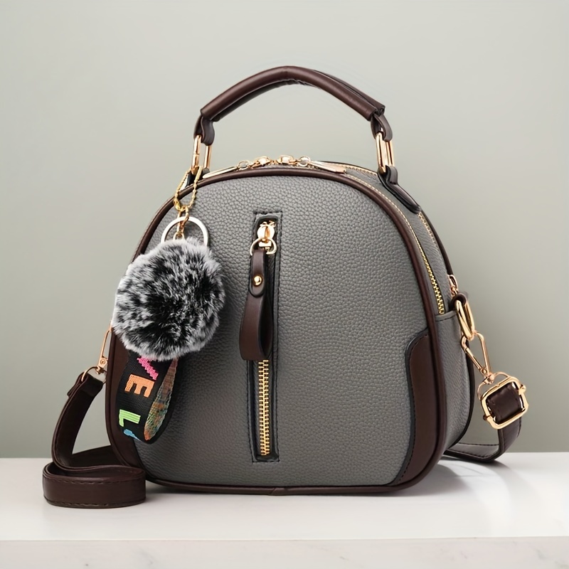 

Stylish Women's Handbag - Large Capacity, With Adjustable Strap, Brown & Gray With Golden-tone Hardware, Pom Pom Charm, Zipper Closure, Casual Yet