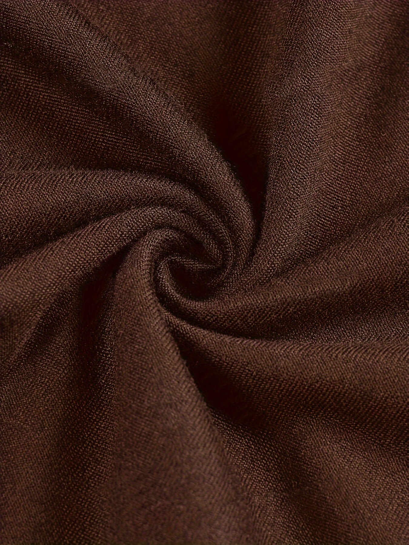 The fabric of a women's long sleeve crop top sold by 100 Spartans